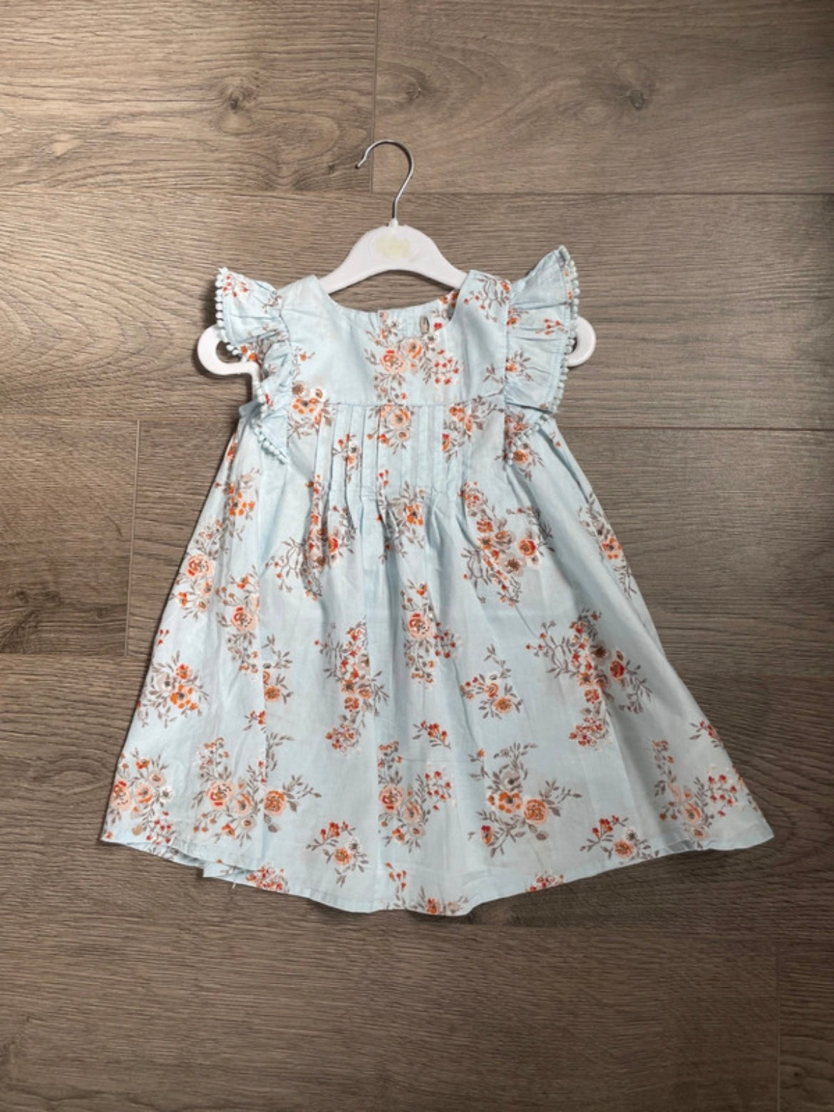 Pale blue sundress with orange flowers (12-18 mths)